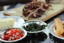 Nyama choma is by far and away one of the most talked about and loved things to eat in Nairobi. <br />
<br />
We ate lunch at a place in the area known for its nyama choma. This is what we ordered (Left to right): Ugali, kachumbari, sukuma wiki (using spinach), matoke (boiled plantain with sauce) and nyama choma. It's only one example of the way nyama choma is eaten (i.e. with a selection of other dishes).